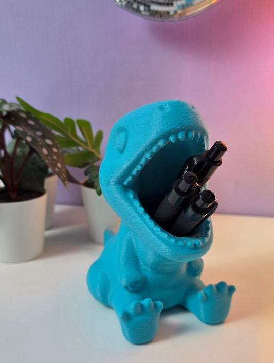 Pennenbakje in de vorm van een dino met de mond open