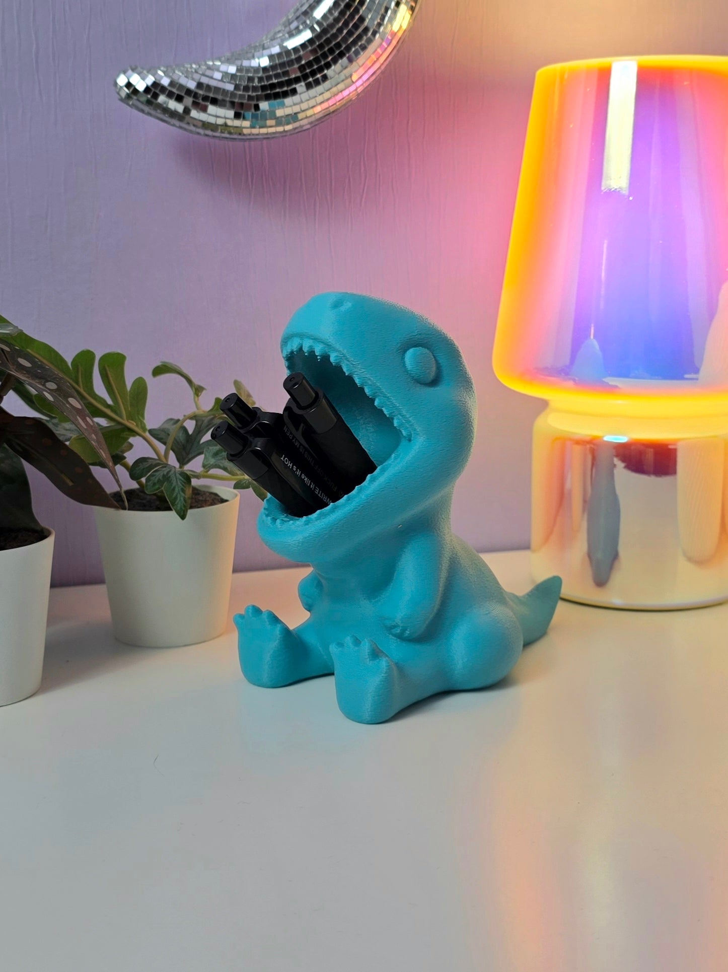 Pennenbakje in de vorm van een dino met de mond open